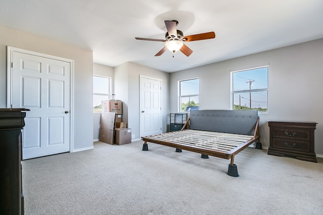 6376 Fm 380, San Angelo, TX 76905 - carpeted bedroom featuring baseboards, ceiling fan, and two closets
