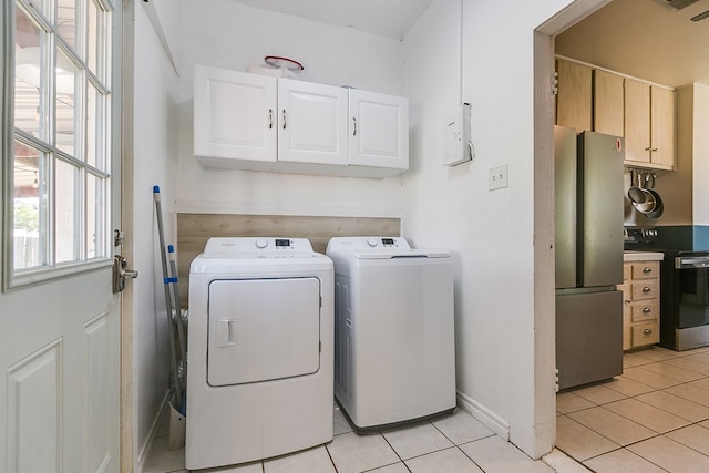 6376 Fm 380, San Angelo, TX 76905 - washroom with washing machine and clothes dryer, cabinet space, light tile patterned floors, and baseboards