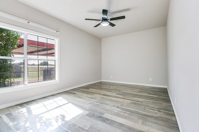 6376 Fm 380, San Angelo, TX 76905 - empty room featuring wood finished floors, a ceiling fan, and baseboards