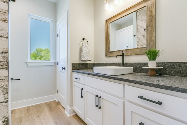 bathroom featuring vanity and hardwood / wood-style floors