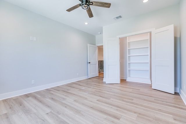 unfurnished bedroom featuring light hardwood / wood-style flooring, a closet, and ceiling fan