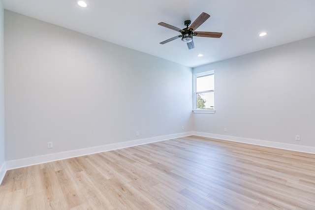 empty room with light hardwood / wood-style floors and ceiling fan