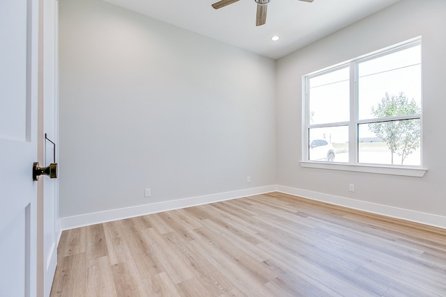 unfurnished room featuring light hardwood / wood-style floors and ceiling fan