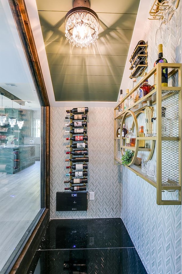 wine room featuring a chandelier