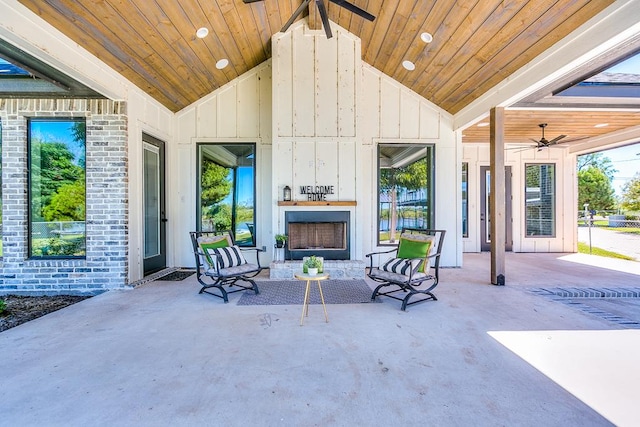 view of patio / terrace featuring an outdoor fireplace and ceiling fan