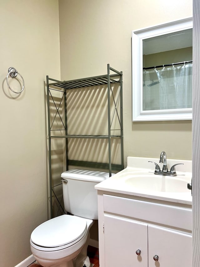 1013 Wynne Ave, San Angelo, TX 76905 - bathroom featuring vanity and toilet