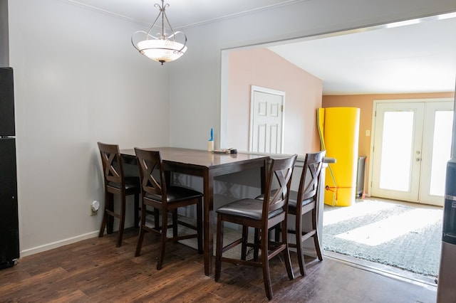 dining area featuring french doors and dark wood-type flooring