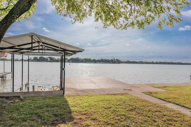 view of dock featuring a water view and a lawn