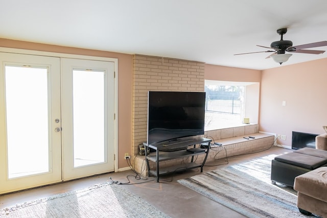 living room with ceiling fan and french doors