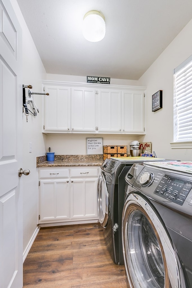 6038 Winners Cir, San Angelo, TX 76904 - laundry room with cabinet space, washer and dryer, and wood finished floors