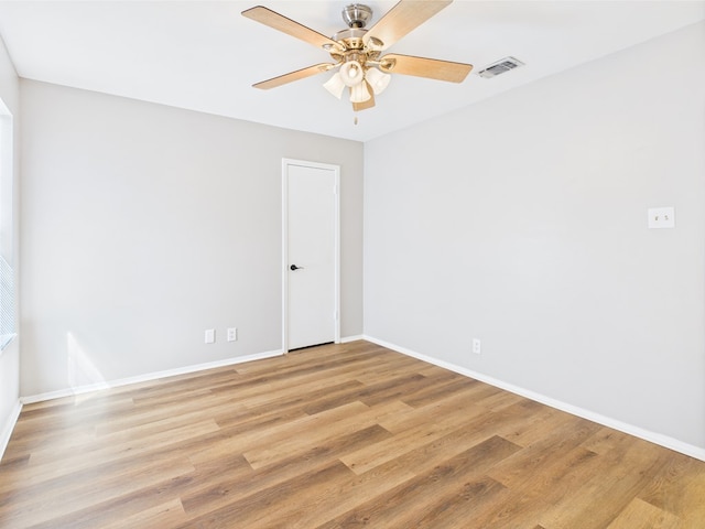 1203 Gordon Blvd, San Angelo, TX 76905 - unfurnished room with ceiling fan, light wood-style flooring, and baseboards