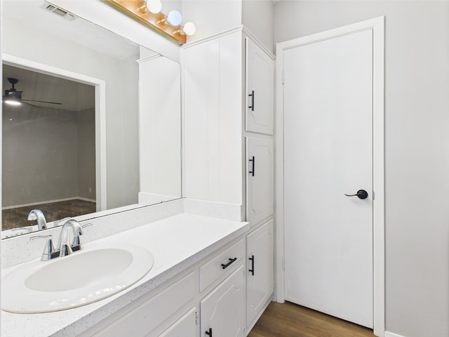 1203 Gordon Blvd, San Angelo, TX 76905 - bathroom featuring vanity, wood finished floors, and ceiling fan