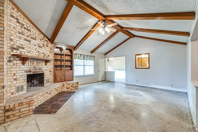 unfurnished living room featuring ceiling fan, a fireplace, a textured ceiling, and vaulted ceiling with beams