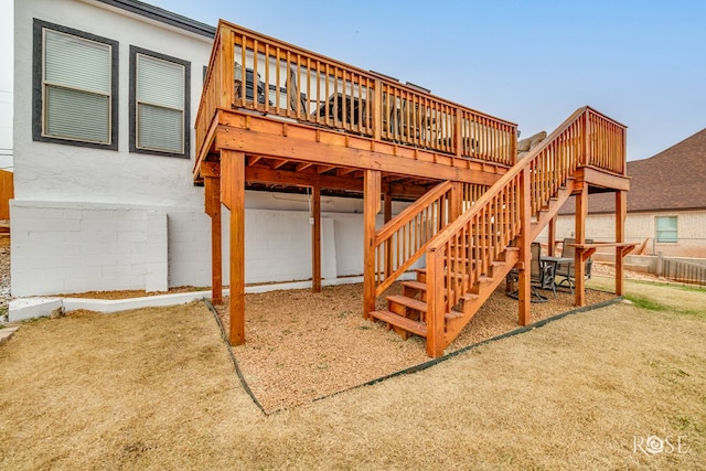 rear view of property featuring a wooden deck