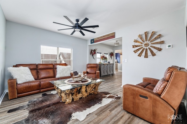 living room with hardwood / wood-style floors and ceiling fan