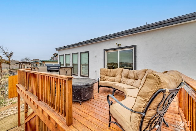 deck featuring grilling area and an outdoor hangout area