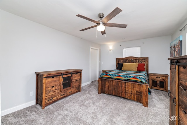 bedroom featuring light carpet and ceiling fan