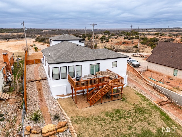 back of property featuring a wooden deck