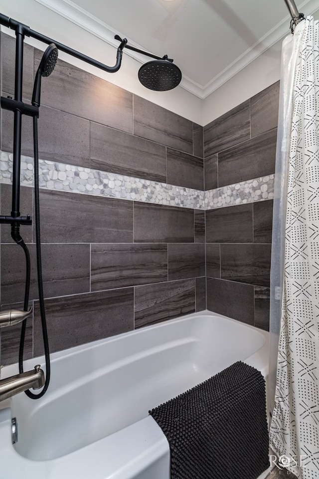 bathroom with crown molding and shower / tub combo with curtain