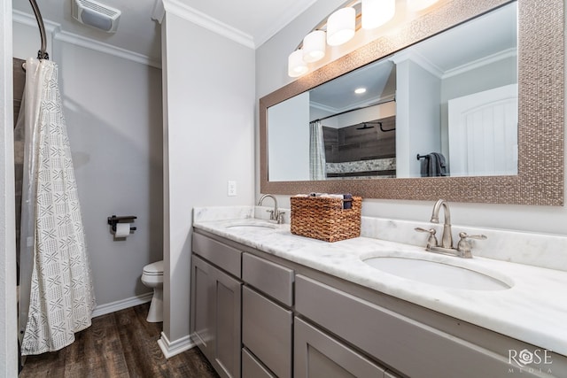 bathroom featuring crown molding, a shower with shower curtain, vanity, wood-type flooring, and toilet