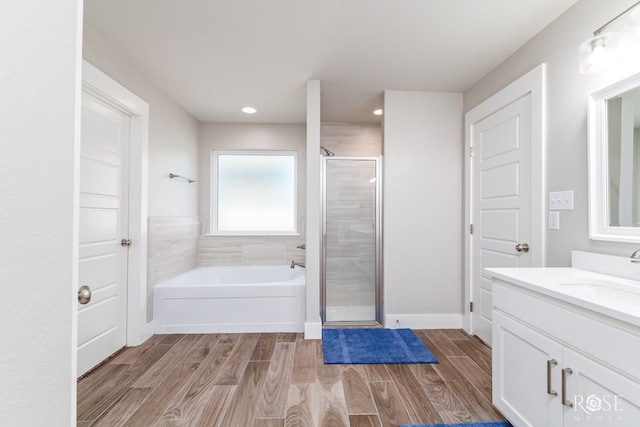 bathroom with vanity and separate shower and tub