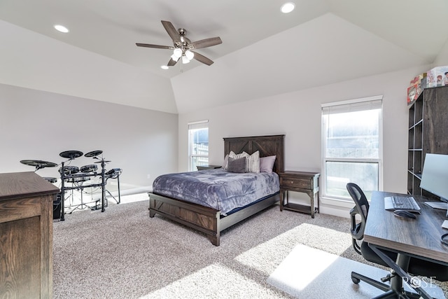 bedroom featuring lofted ceiling, light colored carpet, and ceiling fan