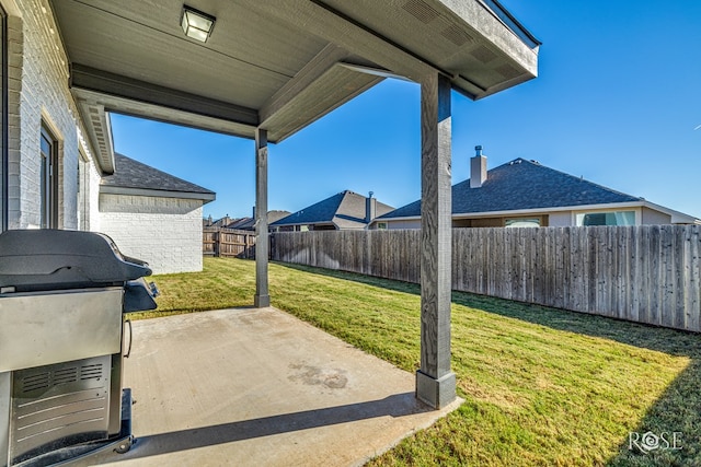 view of patio featuring a grill