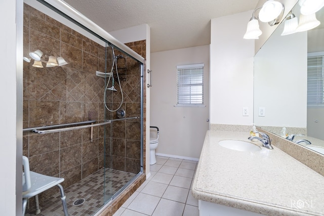 bathroom featuring a shower with door, tile patterned flooring, vanity, a textured ceiling, and toilet