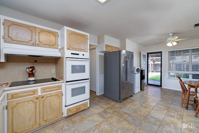 kitchen with white double oven, ceiling fan, black electric stovetop, high quality fridge, and a textured ceiling