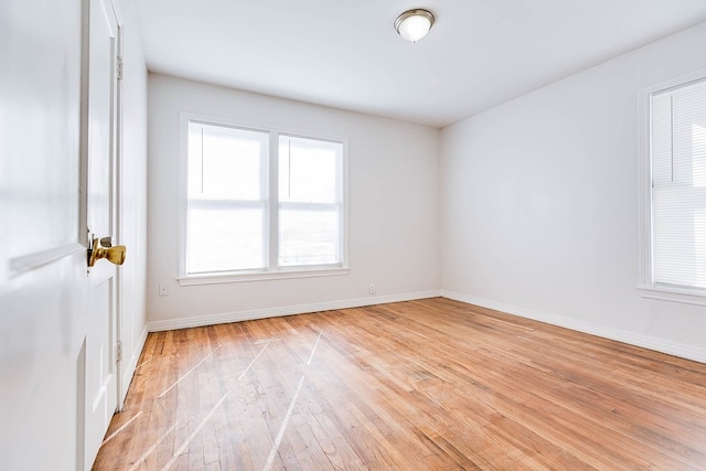 1221 Howard Ave, San Angelo, TX 76901 - unfurnished room with light wood finished floors and healthy amount of natural light