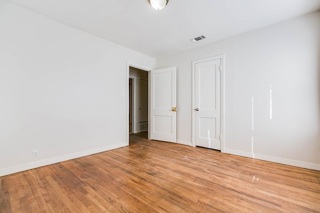 1221 Howard Ave, San Angelo, TX 76901 - unfurnished bedroom featuring light wood-style flooring and baseboards