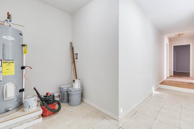 1221 Howard Ave, San Angelo, TX 76901 - hall featuring electric water heater and light tile patterned flooring