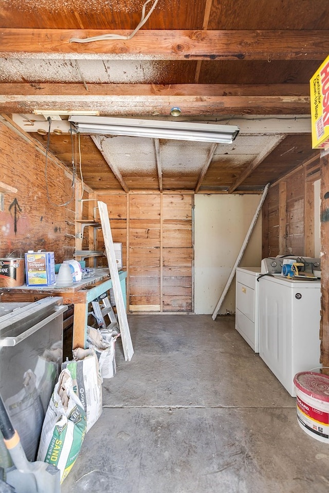 1221 Howard Ave, San Angelo, TX 76901 - garage featuring wooden walls and separate washer and dryer