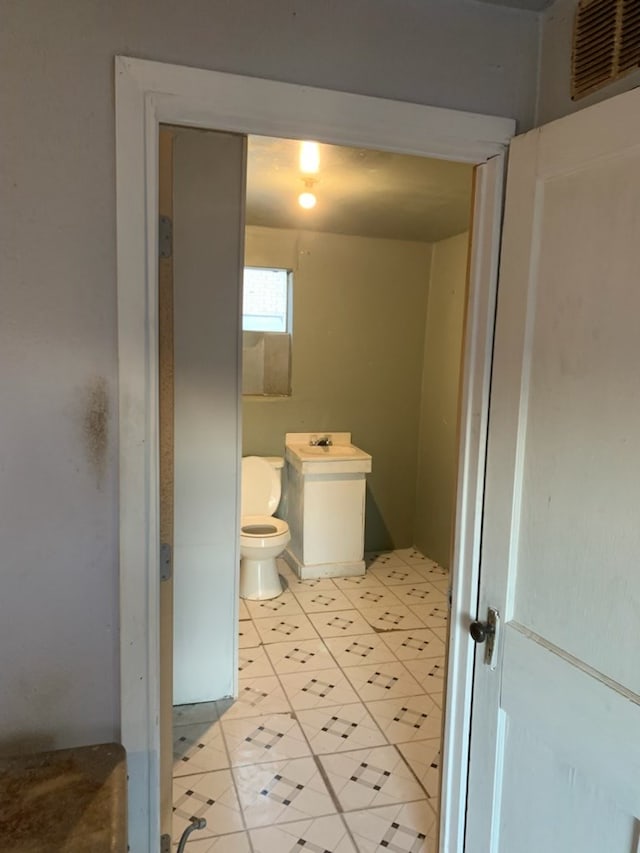 620 W 19th St, San Angelo, TX 76903 - bathroom featuring toilet and tile patterned flooring