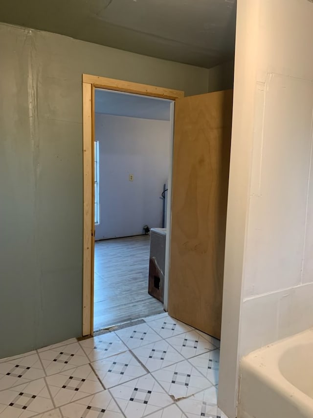 620 W 19th St, San Angelo, TX 76903 - bathroom featuring tile patterned floors and a tub