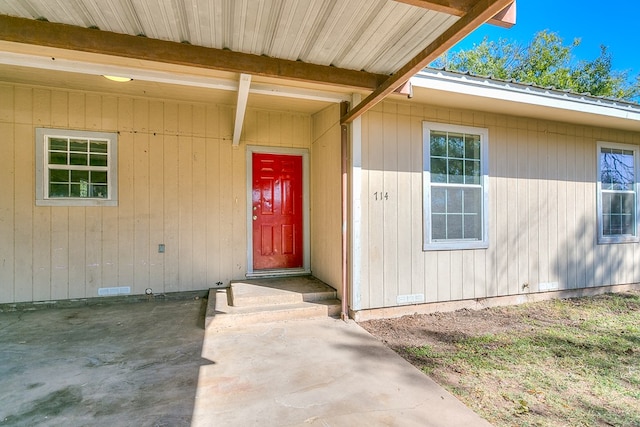 entrance to property with a patio area