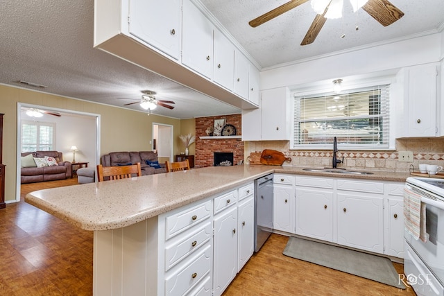 2713 Canyon Creek Dr, San Angelo, TX 76904 - kitchen featuring a ceiling fan, a sink, stainless steel dishwasher, light wood-style flooring, and electric range