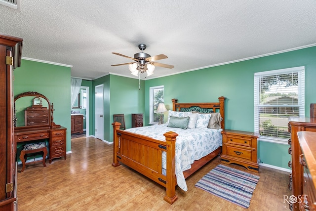 2713 Canyon Creek Dr, San Angelo, TX 76904 - bedroom featuring light wood-style flooring, baseboards, ornamental molding, a textured ceiling, and ceiling fan