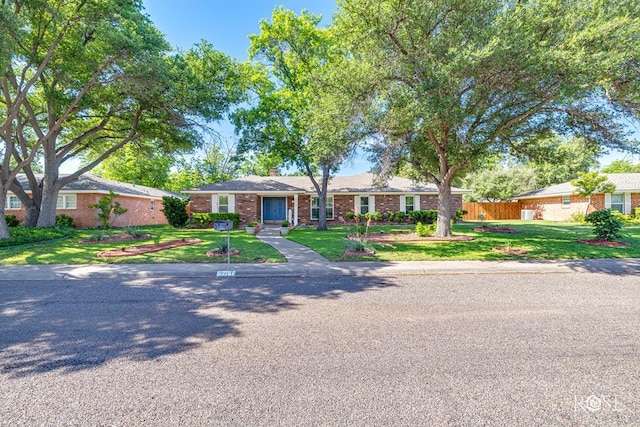 2713 Canyon Creek Dr, San Angelo, TX 76904 - single story home featuring a chimney and brick siding