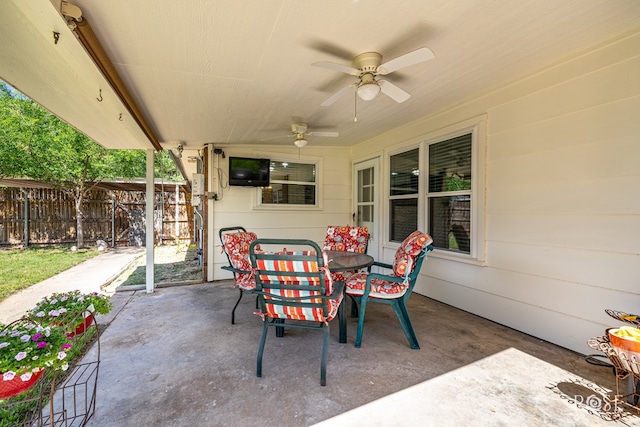 2713 Canyon Creek Dr, San Angelo, TX 76904 - view of patio / terrace with fence, outdoor dining space, and a ceiling fan