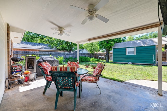 2713 Canyon Creek Dr, San Angelo, TX 76904 - view of patio / terrace featuring outdoor dining space, ceiling fan, and an outdoor structure