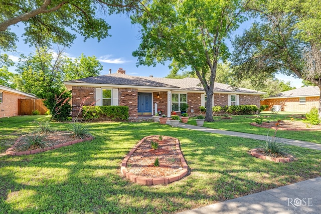 2713 Canyon Creek Dr, San Angelo, TX 76904 - single story home with brick siding and a chimney
