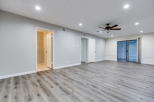 empty room featuring ceiling fan and light wood-type flooring