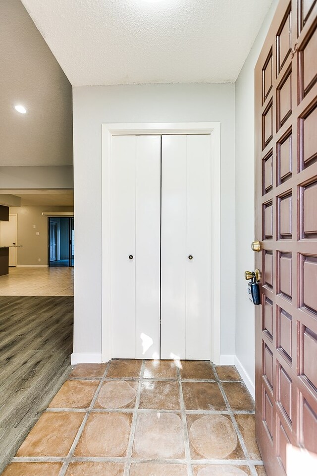 entryway featuring a textured ceiling