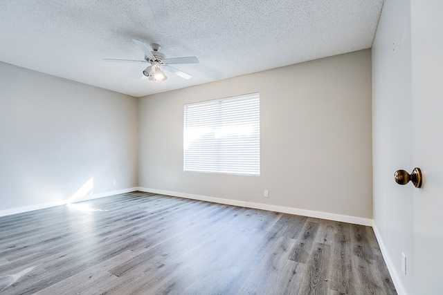 unfurnished room with ceiling fan, a textured ceiling, and light hardwood / wood-style flooring