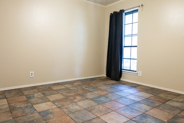 3329 Clearview Dr, San Angelo, TX 76904 - empty room featuring baseboards, crown molding, and dark stone finish floors