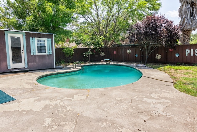 3329 Clearview Dr, San Angelo, TX 76904 - view of swimming pool with a fenced backyard, a patio, and an outdoor structure
