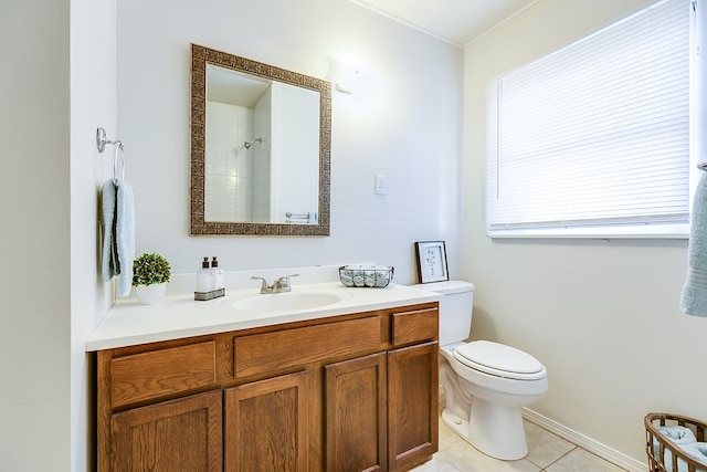 bathroom with vanity, toilet, and tile patterned flooring