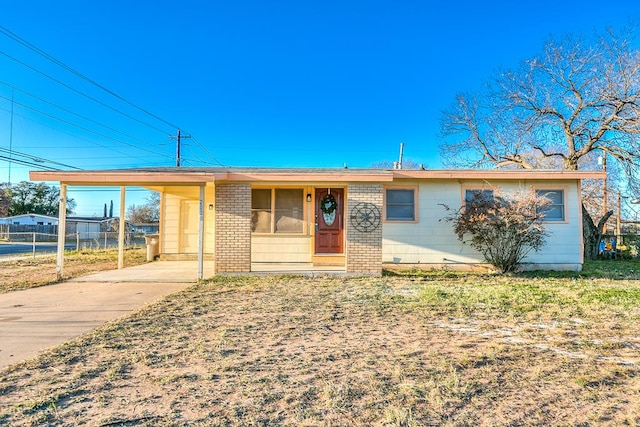 single story home with a carport