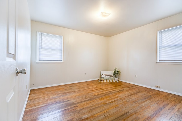 spare room featuring light hardwood / wood-style flooring